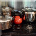 K10. Pots and a kettle. 